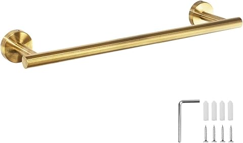 Barre porte-serviettes murale dorée brossée installée dans une salle de bain claire